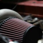 Illustration showing the effects of a dirty car air filter on engine performance and fuel efficiency